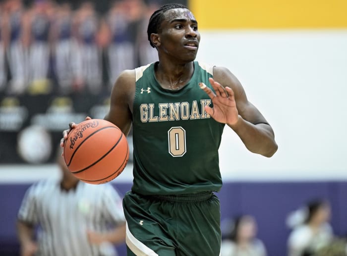 Ja'Corey Lipkins of GlenOak bring the ball up the floor against Jackson in a game on December 22, 2023.